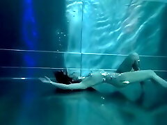 Bond Girl, underwater stunts, bore girl, high heels glamor and underwater swimming retro style 