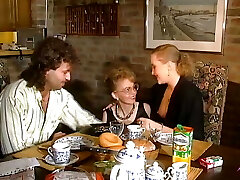 Two stunning German chicks sharing a loaded prick on the kitchen table