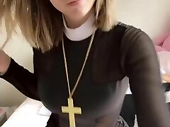 Pious lady with a cross shows her tits and pussy