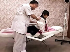 Pigtailed Japanese woman with perky tits gets massaged and f