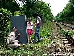 A guy jerks off while watching a couple penetrating outdoors