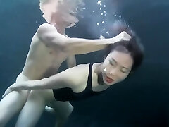 swimsuit girl sex with a guy underwater