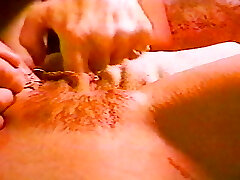 A one of a kind pierced babe scorching her pussy lips spread