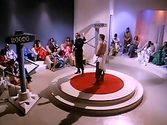 Buck Rogers vs Horny Females at Victim Auction