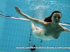 Dark-haired Kristy stripping underwater