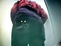 Hidden cam video caught giant backside of Russian brunette in the public toilet