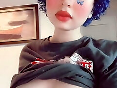 Depressed butterfly goth chick plays with her boobs