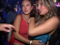 Girls demonstrating and licking tits at a party