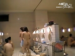 Asian woman with full bumpers sitting at the hidden cam cam dvd 03174
