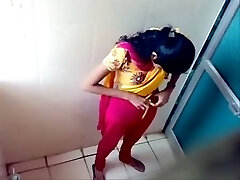 Some amateur Indian brunette ladies peeing in the toilet on voyeur webcam