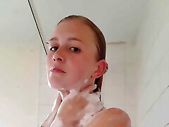 Hot platinum-blonde takes a shower