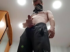 Chav lad masturbates off a big rod in sweatpants and black sneakers