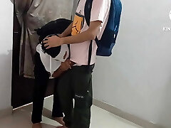 Two college students having gay fun in college library Two college students having gay fun in college library