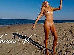 Naked Workout on the beach - a beautiful skinny cougar with small tits