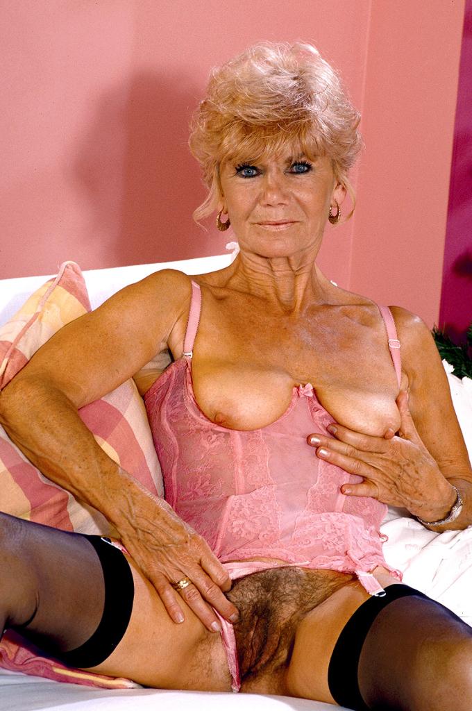 Sexy Blonde Granny - Blonde granny in sexy corset flaunting bushy box