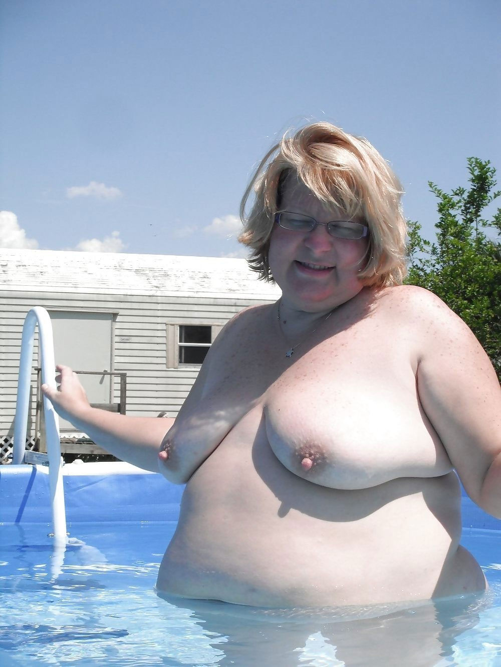 Fat and happy nudist ladies in pool