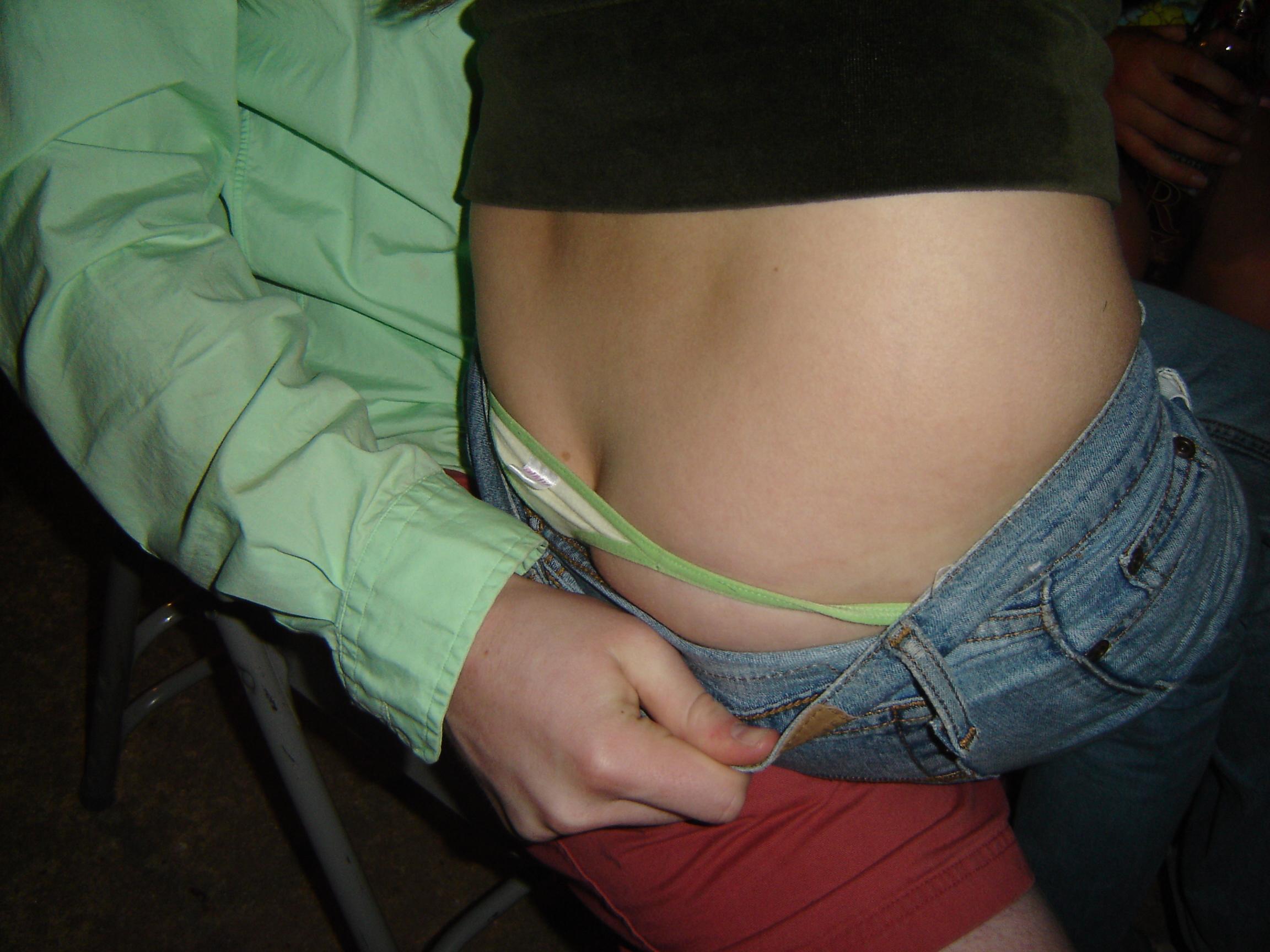 Voyeur cams caught girls-next-door showing off their thongs photo