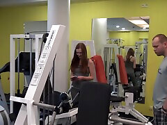 Kinky redhead Linda Sweet spreads legs to have adriana luna tanned body in the gym