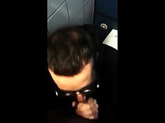 Hot bearded guy sucking guy in public restroom