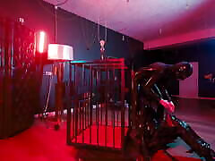 Rubber Nights: the gay daddy vintage Slave Rests Tight in a Cage Under the Bed