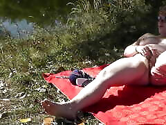 MILF solo. Wild beach. Public nudity. Sexy MILF on river bank fingers wet pussy and has strong orgasm. sarah tribute in public. Outdoors