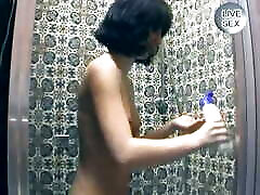 Dark haired beauty from Germany pleasing her muff after a shower