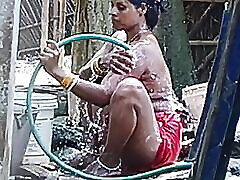 Desi lez momo and girl bhabhi bathing in outdoor