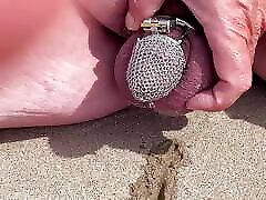 Piss in a chastity cage outdoors in front of his wife Piss in a chastity cage outdoors in front of his wife