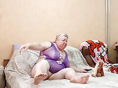 Mother-in-law kneads her meaty hairy pussy with big reen fucking toys