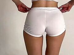 stretching of a beautiful blonde in short shorts