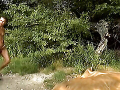 Hot redhead doll rides a big cock in the forest