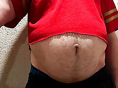 Athlete shows his ball gut and navel