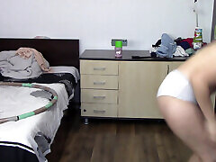 Sexy wife trains naked at home. Sexy brunette tries on stockings, hairy pussy, big ass, big tits.