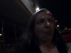 Midnight whore CD is walking around a car parking lot lookking to get lucky