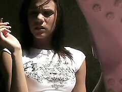 Smoking fetish with a teen brunette