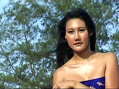 Asian babes getting face kick box on the beach