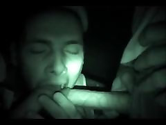 3 friends have fun with a night vision camera