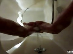 Pretty brunette Dani Daniels takes a shower