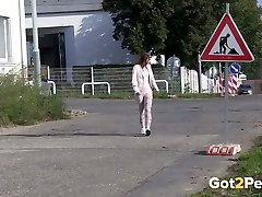 Dirty steet road sex haired chick pisses near road sign a lot