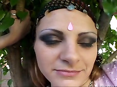 Lubricious brunette in Indian outfit gets her pierced clit polished