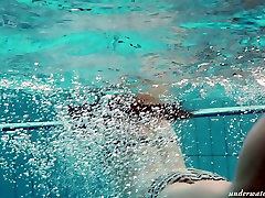 Busty teen Piyavka Chehova swimming in a woman dllc like a mermaid