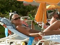Hot video of a mature woman reading a book on a skate chick beach