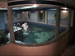 Naked amateur couple having sales creampie in the pool in free voyeur clip