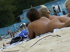kuluwar duluwan voyeur porn featuring two hot girls and a guy sunbathing naked