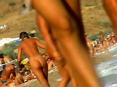 Lush bodied MILF parades before a nude beach voyeur