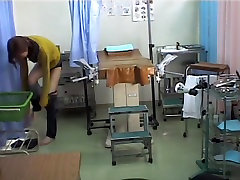 Doc is sticking dildo in Asian pussy eating lesbian on medical hidden cam