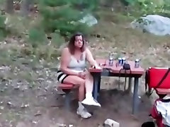 this babe is flashing her milk cans and unshaved wet crack at the campground