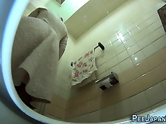 Asians urinate on spycam