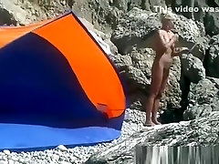 Blonde nudist woman secretly filmed at beach