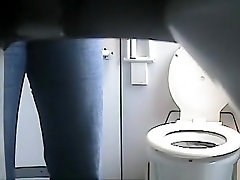 Hidden cam in gagging open toilet films women peeing
